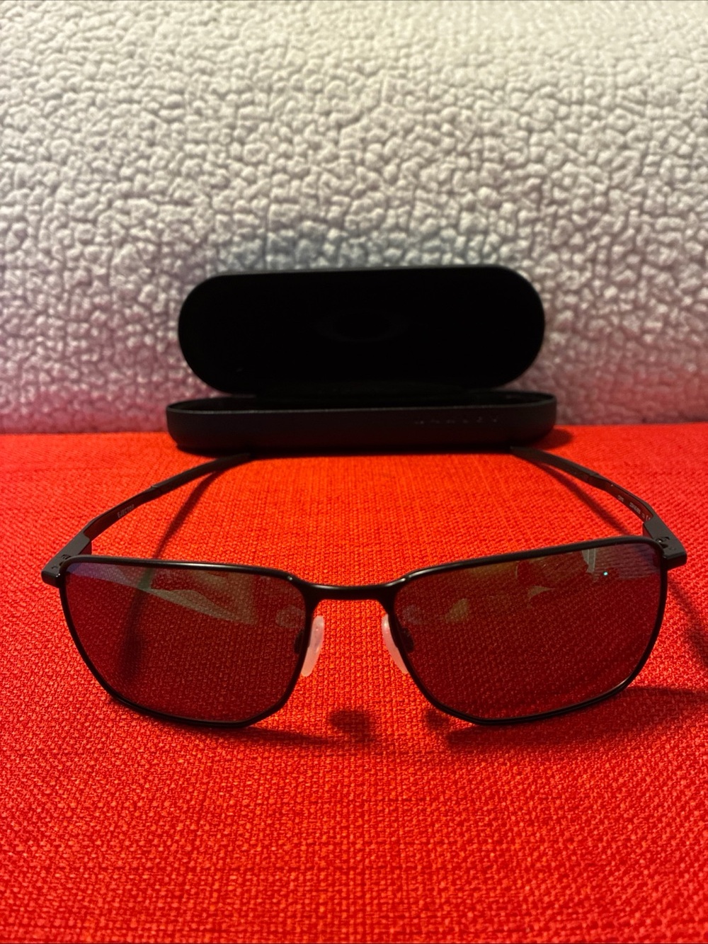 Oakley Black Frame Sunglasses with Dark Lenses
